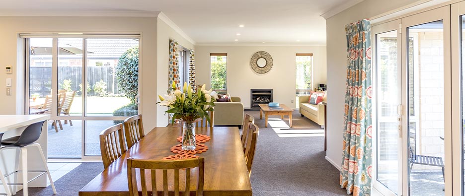 Bright open plan living space with lots of windows