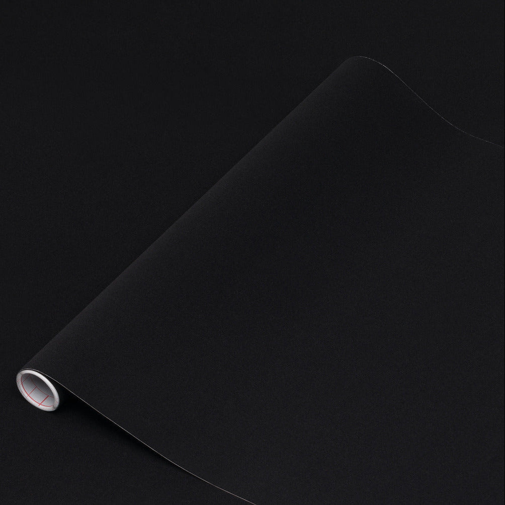 Roll of black velour on a black background