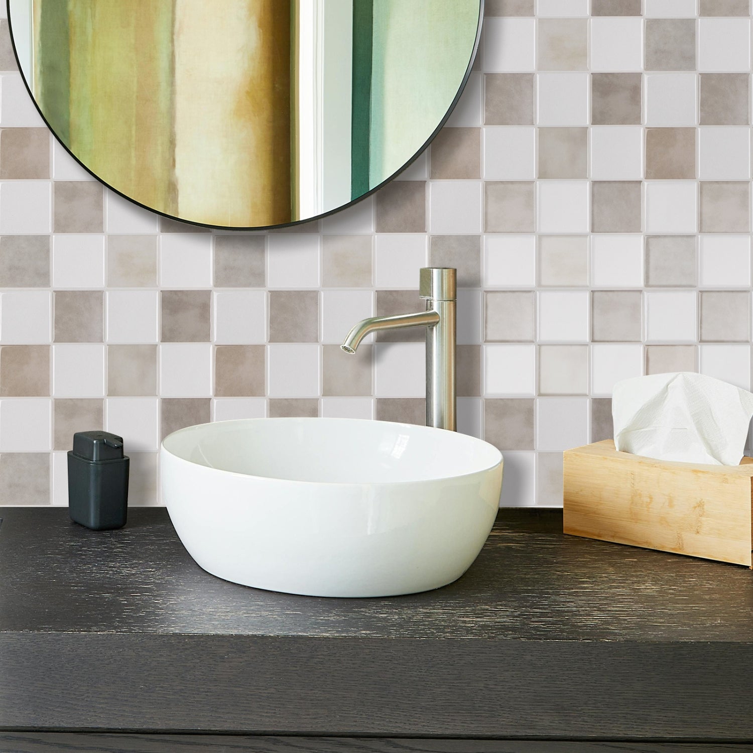 Bathroom vanity with white sink, silver faucet, and checkered tile wall.