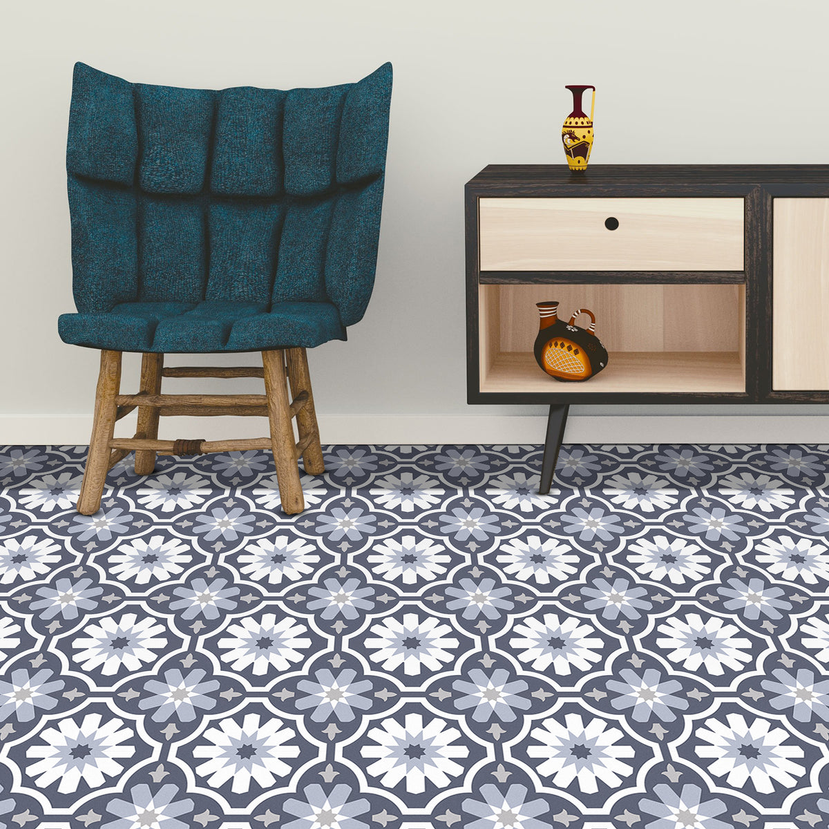 Blue patterned vinyl floor tiles in a room with a chair and cabinet.