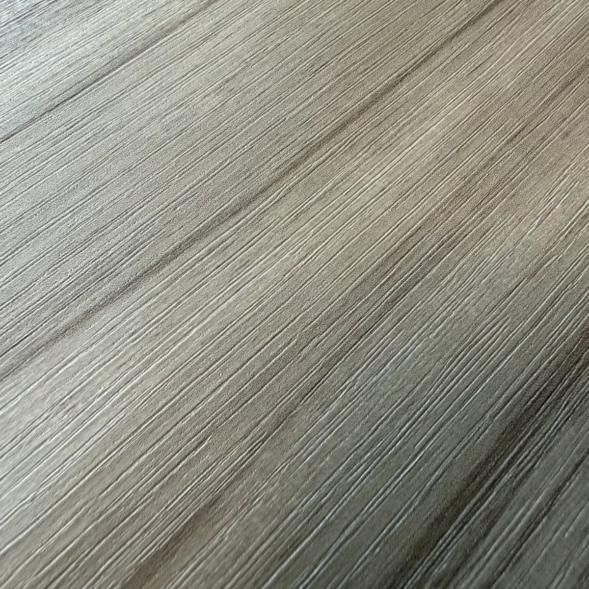 Close-up of a teak edge grain adhesive vinyl