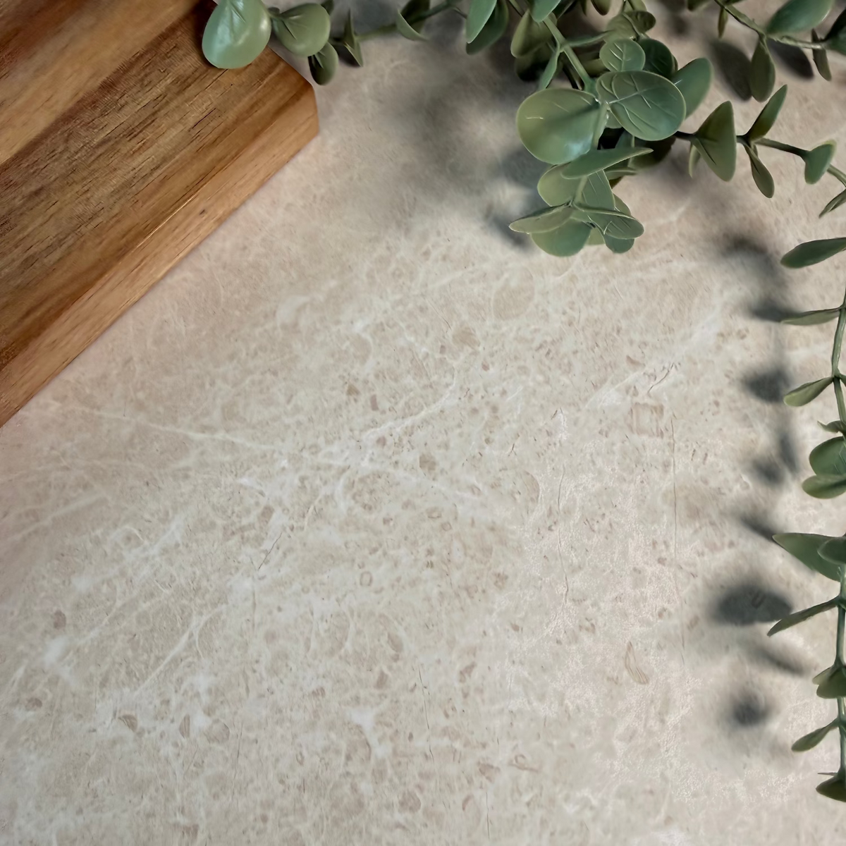 Beige adhesive vinyl with a wooden cutting board and green leaves in the corner