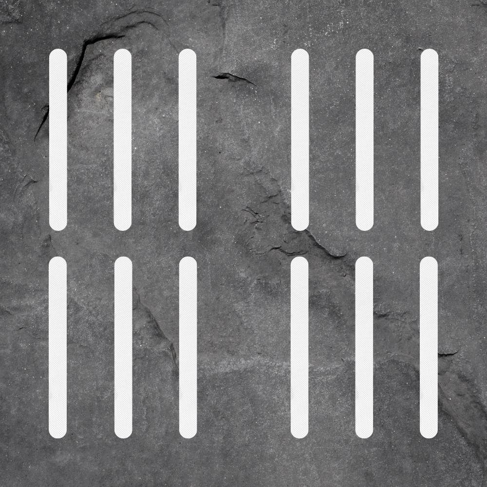 White anti-slip grip strips in stairs to prevent slipping