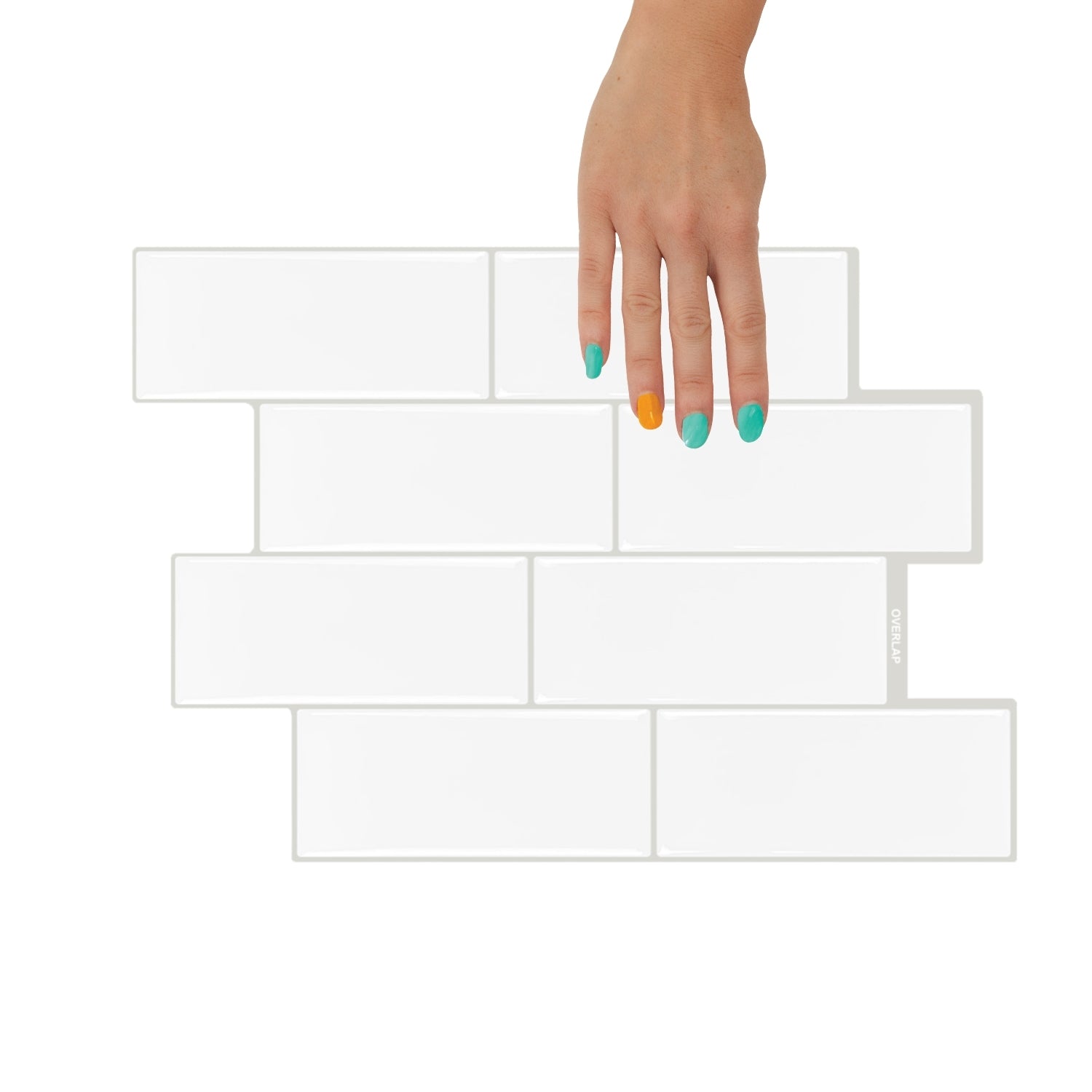 Clear glass vase with flowers on a kitchen counter against a white tiled wall.