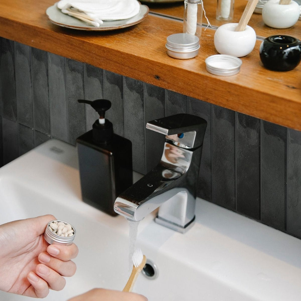 Black stacked subway tiles as bathroom splash back