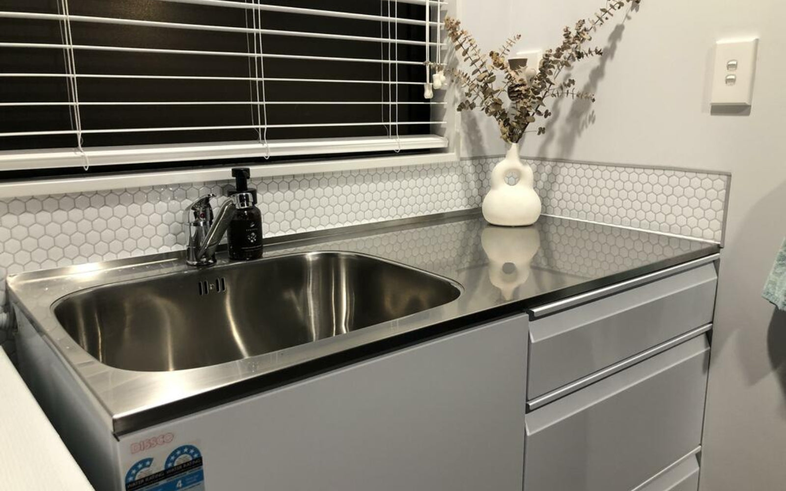 hexagon tiles splashback in laundry