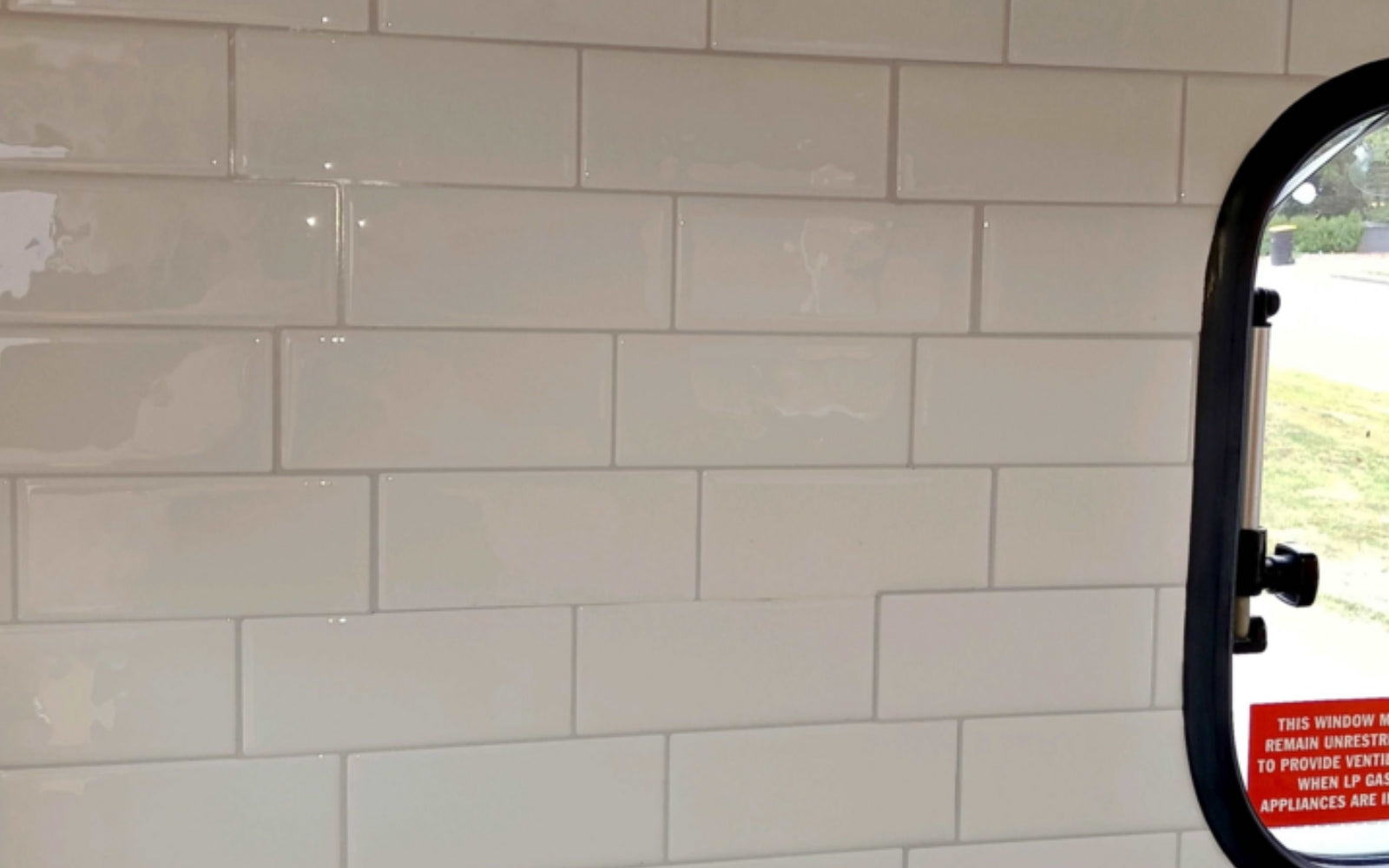 White tiled wall in a caravan