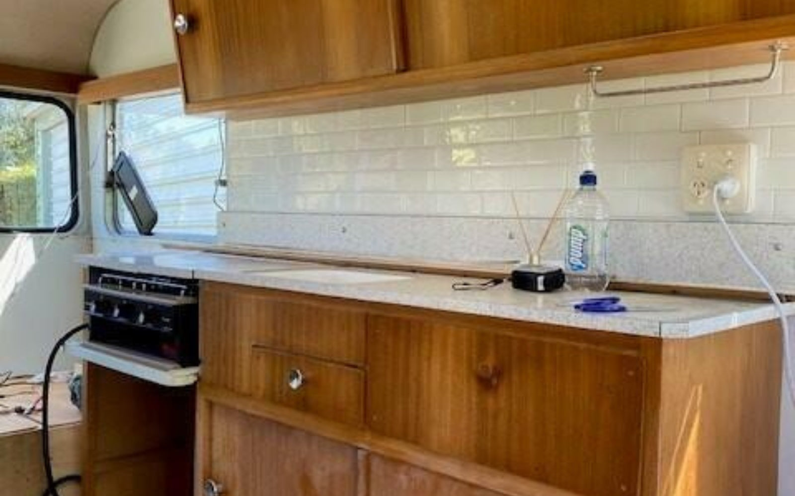 white self-adhesive tiles installed in a caravan