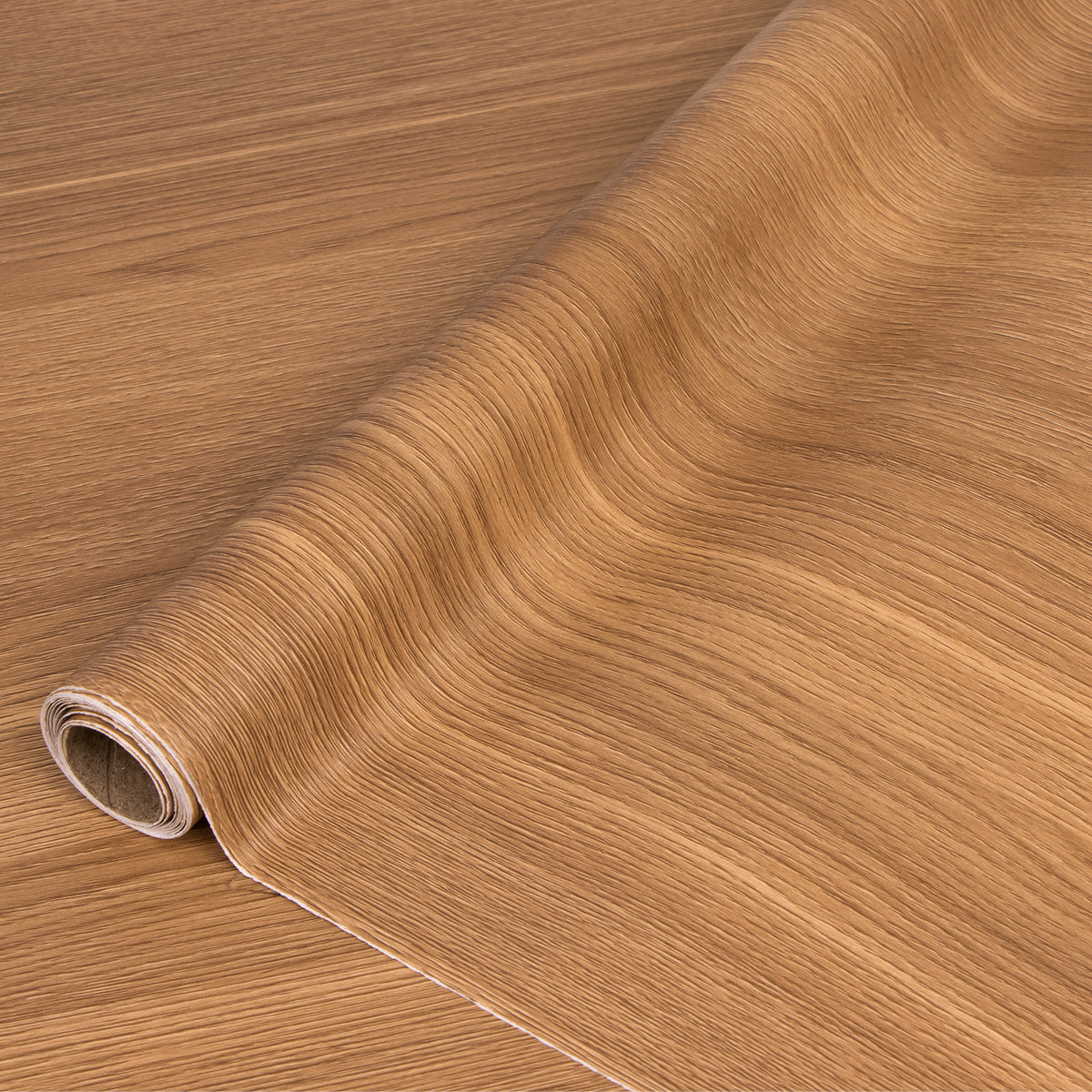 Roll of wooden texture adhesive vinyl on a wooden surface