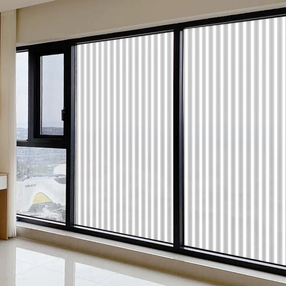 Window with black frame and reeded window film