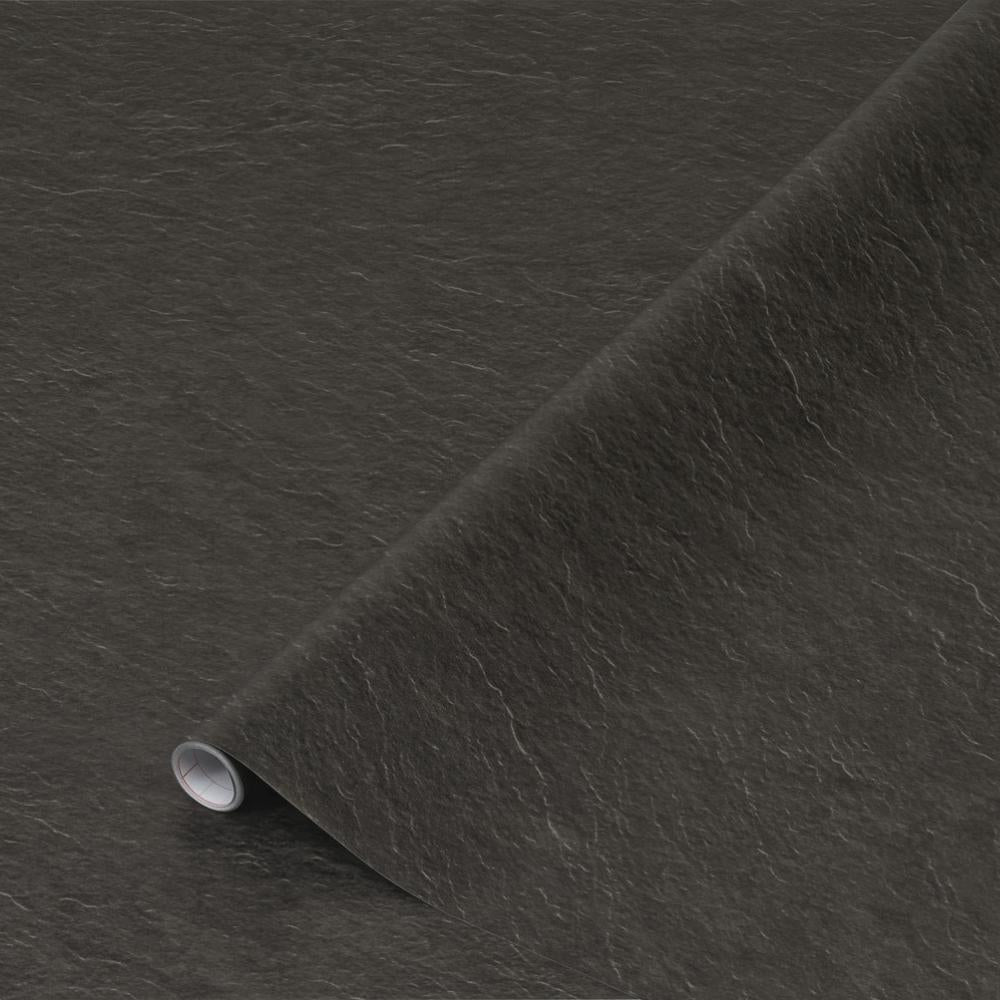 A close-up image of a drawer wrapped in slate matte adhesive vinyl with a textured appearance, placed in a white furniture piece.