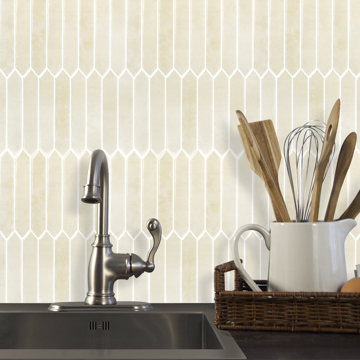 Kitchen sink area with geometric tile pattern on the wall