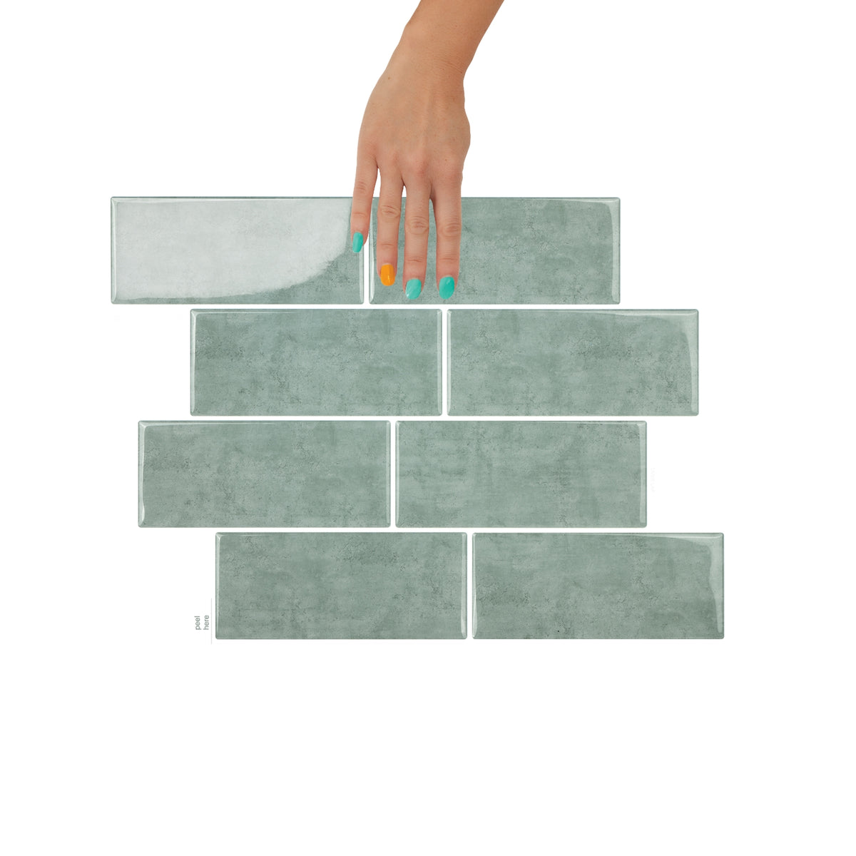 Set of green tiles with a hand holding one tile on a white background