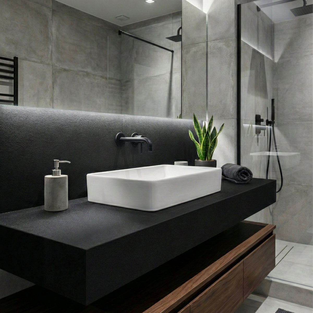 Modern bathroom with a black vinyl wrapped vanity, white sink, and decorative elements.