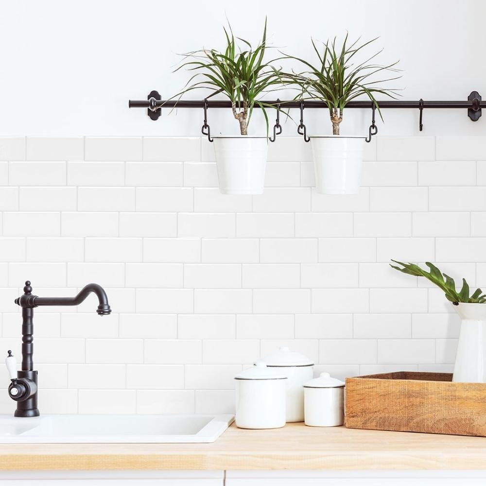 Kitchen splash back with white subway tiles and grey grout