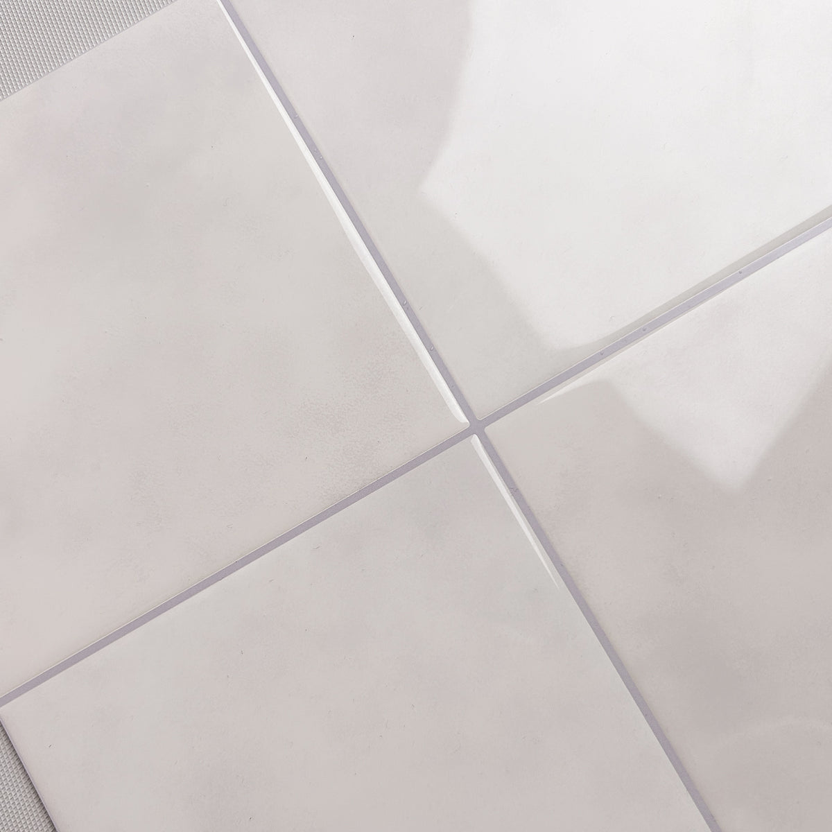 Close-up of sand coloured Zellige tiles with a subtle pattern