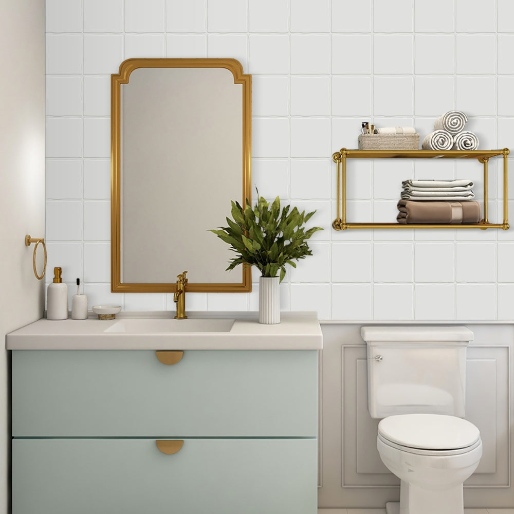 Bathroom interior with a vanity, mirror, and toilet.