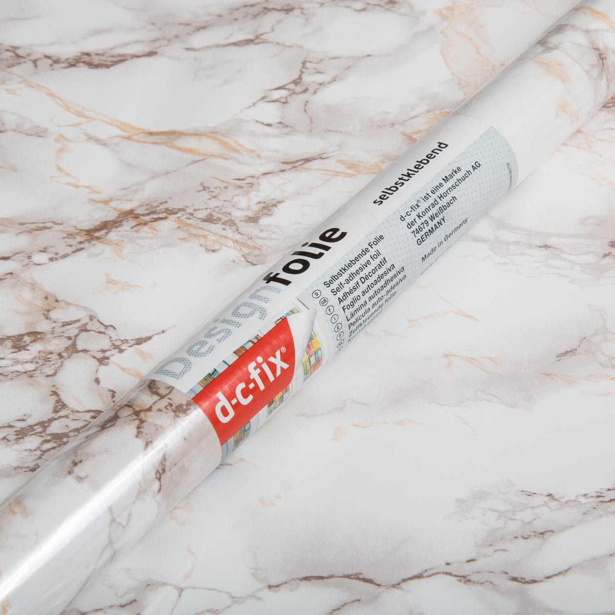 Roll of d-c-fix designfolie on a marble surface