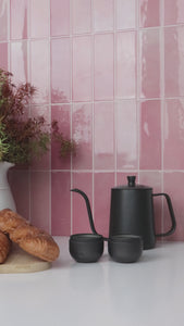 Pink stacked subway tiles installation