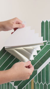 Installation of green slim picket wall tiles