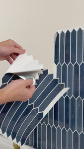 Installation of slim picket blue peel and stick wall tiles
