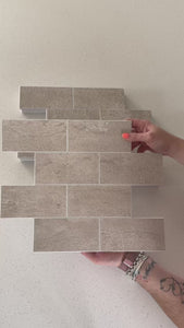 subway tetured beige composite tiles being shown