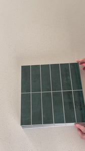 Stacked subway emerald teal composite tiles being shown