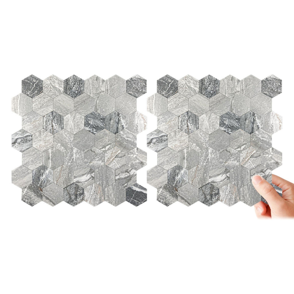 Two sheets of hexagonal mosaic tile with a grey marble pattern, shown against a plain white background with a hand pointing to the right sheet.